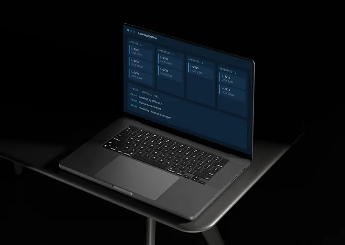 A laptop showing a SACCO loans pipeline with sample data.